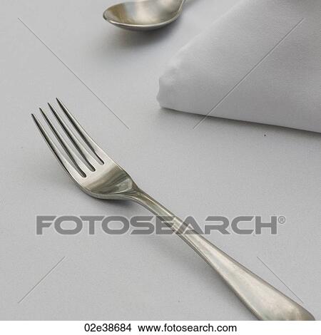 Cutlery on a table set for dining View Large Photo Image Picture - Cutlery on a table set for dining. Fotosearch