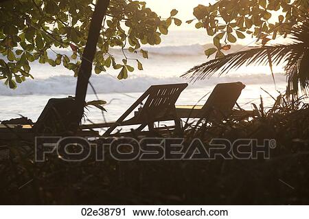 Deckchairs along Mal Pais coastline in San Jose Costa Rica View Large Photo Image Stock Image - Deckchairs along Mal Pais coastline in San Jose Costa Rica. Fotosearch