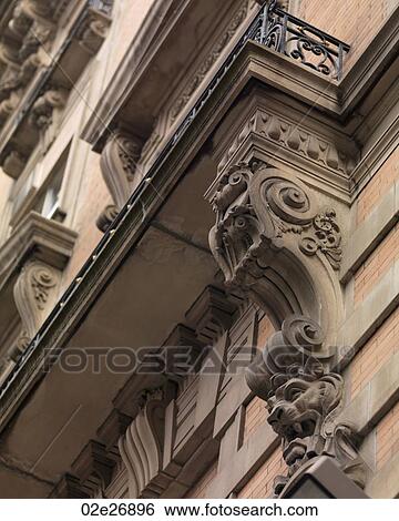Decorative carvings on exterior of a building in Manhattan, New York City, U. S. A. View Large Photo Image Stock Photograph - Decorative carvings on exterior of a building in Manhattan, New York City, U. S. A.. Fotosearch