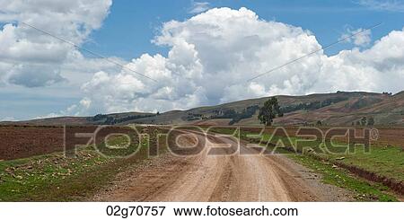 Dirt road passing through an agricultural field, Sacred Valley, Cusco Region, Peru View Large Photo Image Stock Photo - Dirt road passing through an agricultural field, Sacred Valley, Cusco Region, Peru. Fotosearch
