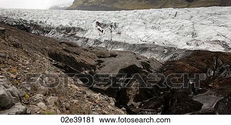 Stock Image - Dirty glacial valley with moraine. Fotosearch