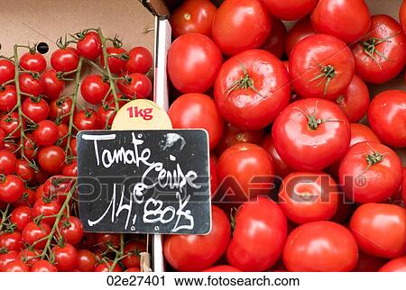Stock Image - Display of tomatoes in Paris France. Fotosearch