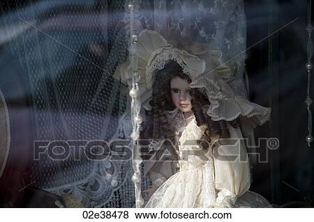 Doll in a window in downtown historic district of Branson, Missouri View Large Photo Image Stock Photo - Doll in a window in downtown historic district of Branson, Missouri. Fotosearch