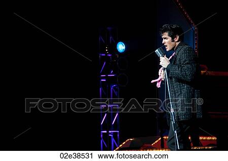 Elvis Presley impersonater performing in Branson, Missouri, U. S. A. View Large Photo Image Stock Image - Elvis Presley impersonater performing in Branson, Missouri, U. S. A.. Fotosearch