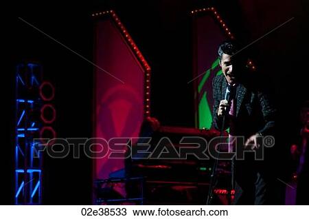 Elvis Presley impersonator performing in Branson, Missouri, U. S. Ao View Large Photo Image Stock Image - Elvis Presley impersonator performing in Branson, Missouri, U. S. Ao. Fotosearch
