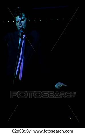 Elvis Presley impersonator performing in Branson, Missouri, U. S. A. View Large Photo Image Stock Photo - Elvis Presley impersonator performing in Branson, Missouri, U. S. A.. Fotosearch
