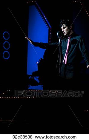 Elvis Presley impersonator performing in Branson, Missouri, U. S. A. View Large Photo Image Stock Photo - Elvis Presley impersonator performing in Branson, Missouri, U. S. A.. Fotosearch