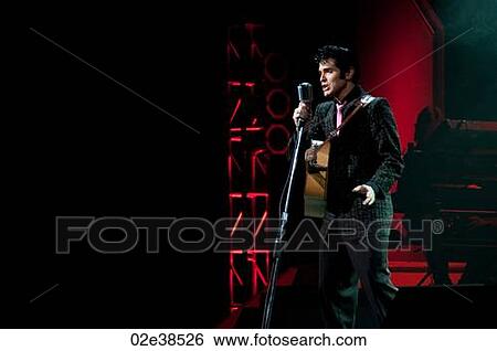 Elvis Presley impersonator performing in Branson, Missouri, U. S. A. View Large Photo Image Stock Photograph - Elvis Presley impersonator performing in Branson, Missouri, U. S. A.. Fotosearch