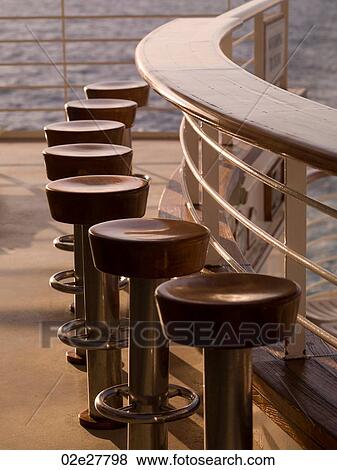 Empty stools on cruise ship View Large Photo Image Stock Photo - Empty stools on cruise ship. Fotosearch