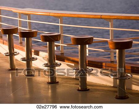 Stock Photograph - Empty stools on cruise ship. Fotosearch