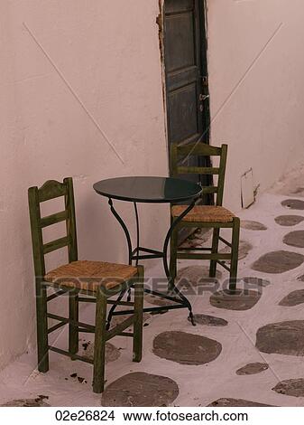 Empty table and chairs in Mykonos Greece View Large Photo Image Picture - Empty table and chairs in Mykonos Greece. Fotosearch