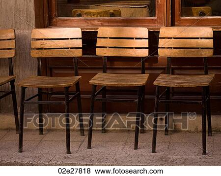 Stock Photo - Empty wooden chairs in Kusadasi Turkey. Fotosearch
