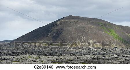 Stock Image - Eroded mountain and rocky volcanic plain. Fotosearch