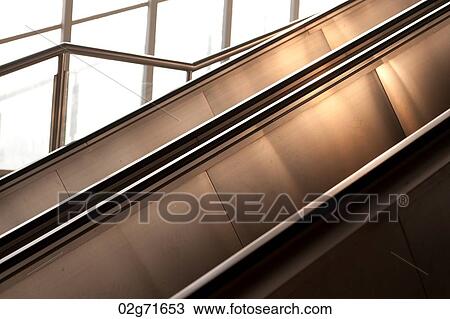 Escalators in a building, Binhai, Tianjin, China View Large Photo Image Stock Image - Escalators in a building, Binhai, Tianjin, China. Fotosearch