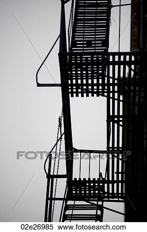 Stock Photography - Exterior fire escape on a building in Manhattan, New York City, U. S. A.. Fotosearch