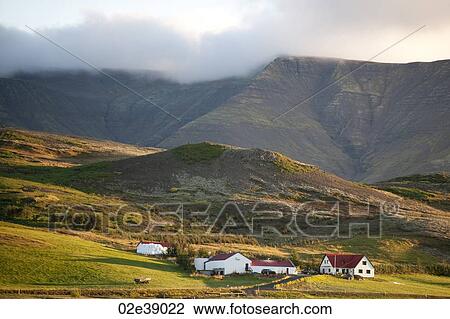 Farm in the shadow of a clouded mountain View Large Photo Image Stock Image - Farm in the shadow of a clouded mountain. Fotosearch