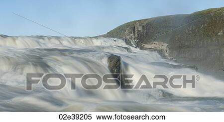 Flowing river cascade past cliff View Large Photo Image Stock Photography - Flowing river cascade past cliff. Fotosearch