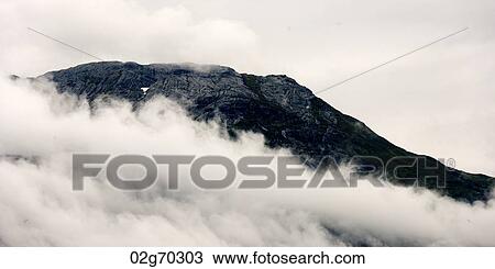 Fog around mountain, Hardangervidda, Hardanger, Norway View Large Photo Image Stock Image - Fog around mountain, Hardangervidda, Hardanger, Norway. Fotosearch