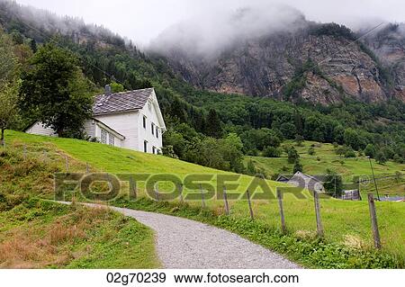 Fog over mountains, Steinsdalsfossen, Hardangervidda, Hardanger, Norway View Large Photo Image Stock Photo - Fog over mountains, Steinsdalsfossen, Hardangervidda, Hardanger, Norway. Fotosearch