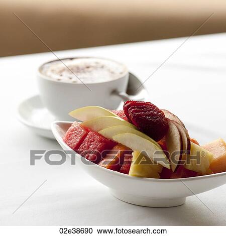 Fresh fruit and cappuccino cup on a table setting in Costa Rica View Large Photo Image Stock Image - Fresh fruit and cappuccino cup on a table setting in Costa Rica. Fotosearch