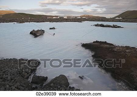 Geothermal power factory, surrounded by rocky landscape with a lake View Large Photo Image Stock Photo - Geothermal power factory, surrounded by rocky landscape with a lake. Fotosearch