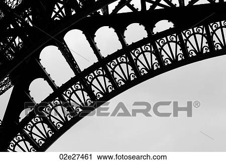 Stock Image - Girders of the Eiffel Tower in Paris France. Fotosearch