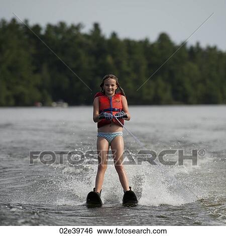 Girl on waterskis at Lake of the Woods, Ontario View Large Photo Image Stock Photograph - Girl on waterskis at Lake of the Woods, Ontario. Fotosearch