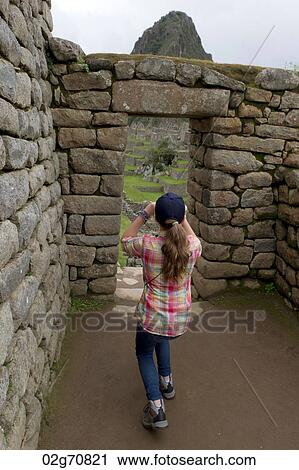 Girl photographing at The Lost City of The Incas, Machu Picchu, Cusco Region, Peru View Large Photo Image Stock Image - Girl photographing at The Lost City of The Incas, Machu Picchu, Cusco Region, Peru. Fotosearch