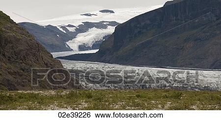 Glacier and terminus in mountain valley View Large Photo Image Stock Photograph - Glacier and terminus in mountain valley. Fotosearch