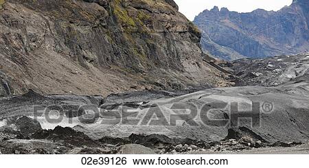 Glacier moraine and debris, rocks ground into glacial flour, in craggy mountains View Large Photo Image Stock Photograph - Glacier moraine and debris, rocks ground into glacial flour, in craggy mountains. Fotosearch