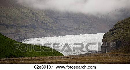 Glacier terminus in rugged mountain valley View Large Photo Image Stock Photo - Glacier terminus in rugged mountain valley. Fotosearch