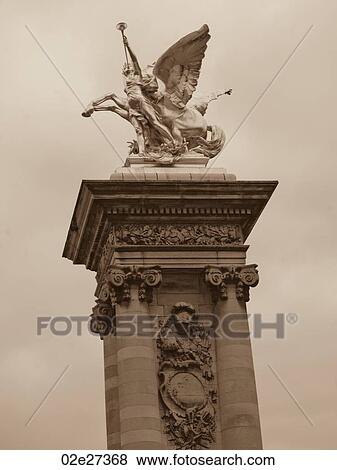 Stock Photo - Golden statue on the Ponte Alexandre III Bridge in Paris France. Fotosearch