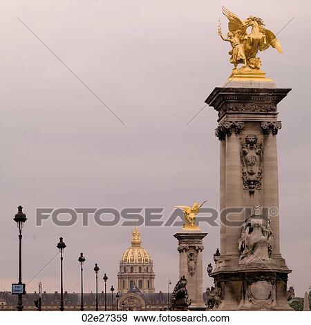 Golden statues on the Pont Alexandre III in Paris France View Large Photo Image Stock Photo - Golden statues on the Pont Alexandre III in Paris France. Fotosearch