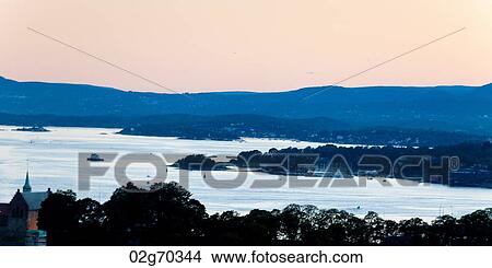 Picture - High angle view of bay at dusk, Oslofjord, Oslo, Norway. Fotosearch