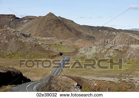 Stock Image - Highway through mountain valley. Fotosearch