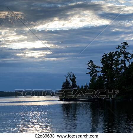 Horizon at dusk at Lake of the Woods, Ontario View Large Photo Image Stock Image - Horizon at dusk at Lake of the Woods, Ontario. Fotosearch
