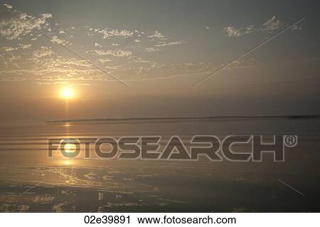 Stock Image - Horizon at sunset in Lake of the Woods, Ontario. Fotosearch