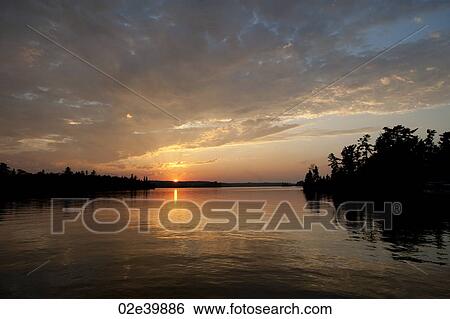 Horizon at sunset in Lake of the Woods, Ontario View Large Photo Image Stock Photograph - Horizon at sunset in Lake of the Woods, Ontario. Fotosearch