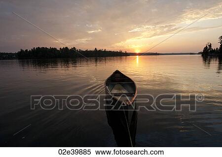 Stock Photography - Horizon at sunset in Lake of the Woods, Ontario. Fotosearch