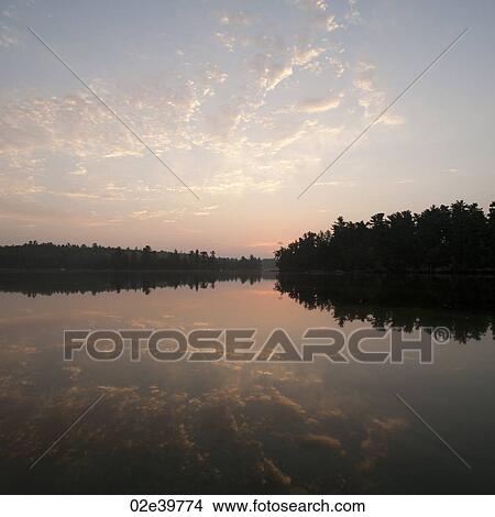 Horizon sky at sunset in Lake of the Woods, Ontario View Large Photo Image Picture - Horizon sky at sunset in Lake of the Woods, Ontario. Fotosearch