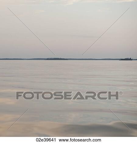 Stock Image - Horizon sky over Lake of the Woods, Ontario. Fotosearch