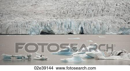 Picture - Icebergs floating in the ocean. Fotosearch