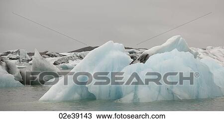 Icebergs floating in the ocean View Large Photo Image Stock Image - Icebergs floating in the ocean. Fotosearch