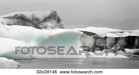 Icebergs floating in the ocean View Large Photo Image Stock Photograph - Icebergs floating in the ocean. Fotosearch