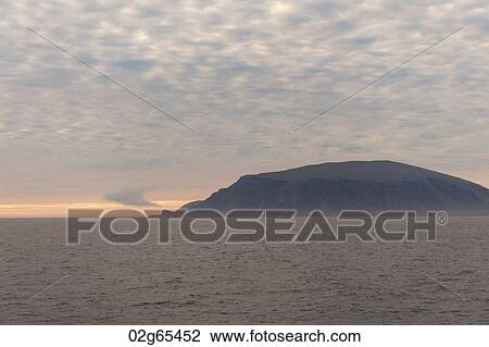 Stock Image - Island in the Pacific Ocean at sunset, Isabela Island, Galapagos Islands, Ecuador. Fotosearch