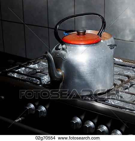 Kettle on a gas stove burner in a kitchen of a guesthouse, Willka Tika, Sacred Valley, Cusco Region, Peru View Large Photo Image Picture - Kettle on a gas stove burner in a kitchen of a guesthouse, Willka Tika, Sacred Valley, Cusco Region, Peru. Fotosearch