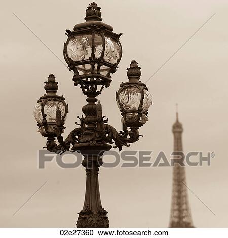 Stock Image - Lampposts on the Pont Alexandre III bridge in Paris France. Fotosearch