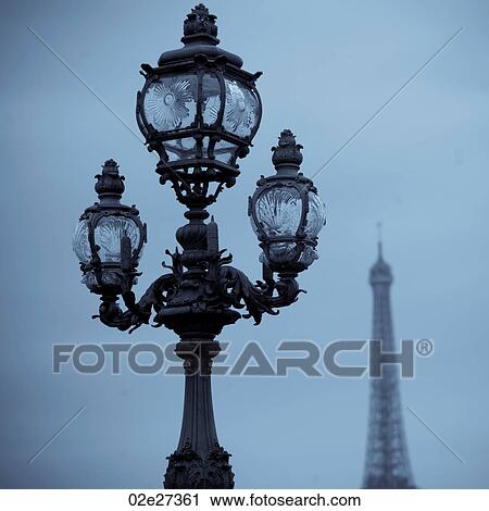 Stock Image - Lampposts on the Pont Alexandre III bridge in Paris France. Fotosearch