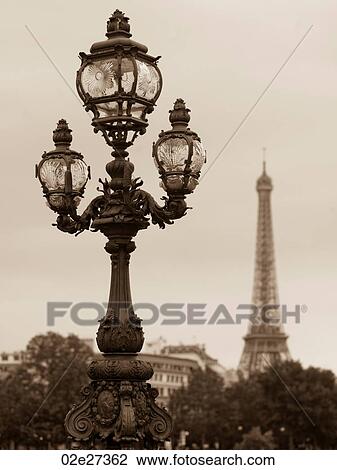 Stock Image - Lampposts on the Pont Alexandre III bridge in Paris France. Fotosearch