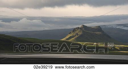 Stock Photo - Landscape, coastline, farmland, hills and mountains. Fotosearch